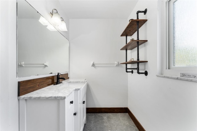 2146 NE 9th St, Ocala, FL 34470 - bathroom featuring baseboards and vanity