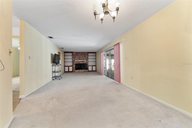 2146 NE 9th St, Ocala, FL 34470 - unfurnished living room with a chandelier, light colored carpet, a brick fireplace, and baseboards