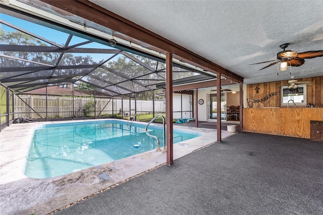 2146 NE 9th St, Ocala, FL 34470 - view of swimming pool featuring a ceiling fan, a patio, a fenced backyard, and glass enclosure