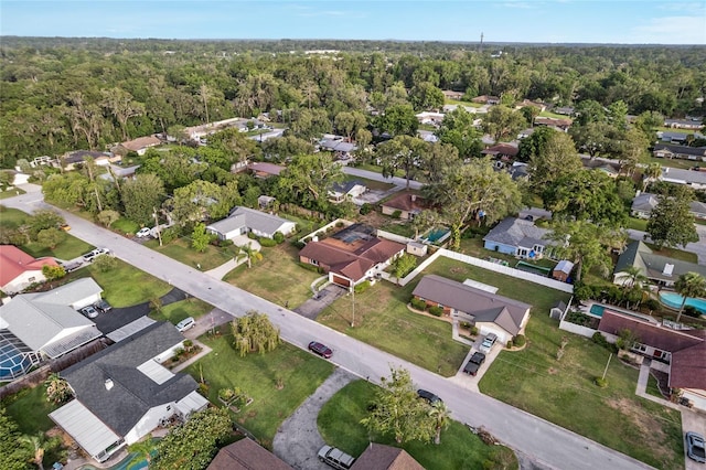 2146 NE 9th St, Ocala, FL 34470 - aerial overview of property's location with nearby suburban area and a heavily wooded area