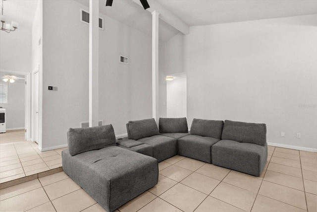 3728 S Eastpark Way, Homosassa, FL 34446 - living area with beamed ceiling, light tile patterned floors, a ceiling fan, high vaulted ceiling, and baseboards