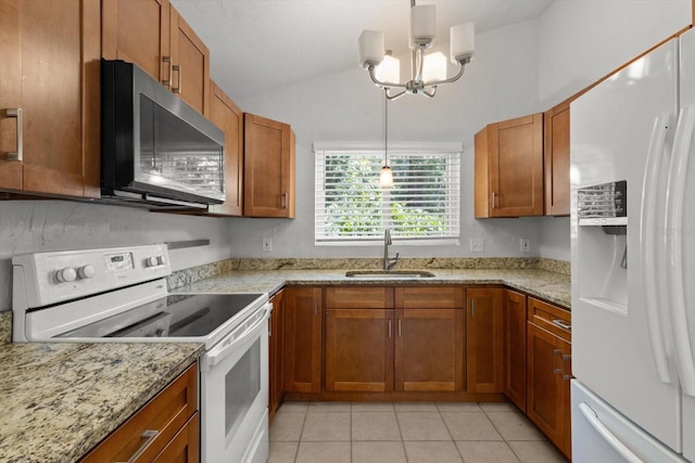 3728 S Eastpark Way, Homosassa, FL 34446 - kitchen with white appliances, a sink, brown cabinetry, lofted ceiling, and light tile patterned floors