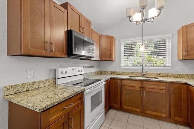 3728 S Eastpark Way, Homosassa, FL 34446 - kitchen with white range with electric stovetop, a sink, lofted ceiling, brown cabinets, and light stone countertops