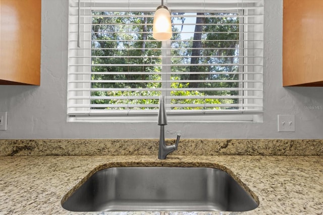 3728 S Eastpark Way, Homosassa, FL 34446 - kitchen view of a sink, light stone countertops, and a textured wall