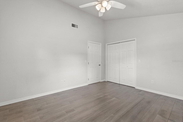 3728 S Eastpark Way, Homosassa, FL 34446 - unfurnished bedroom featuring wood finished floors, baseboards, a ceiling fan, a closet, and vaulted ceiling