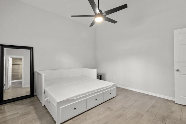 3728 S Eastpark Way, Homosassa, FL 34446 - bedroom featuring light wood-type flooring, baseboards, lofted ceiling, and ceiling fan