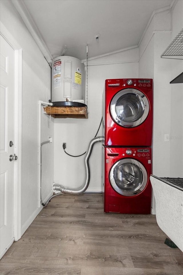 3728 S Eastpark Way, Homosassa, FL 34446 - laundry room featuring stacked washing machine and dryer, electric water heater, and wood finished floors