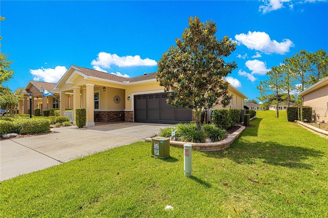9642 SW 95th Loop, Ocala, FL 34481 - view of front of property featuring driveway, an attached garage, stucco siding, and a front lawn