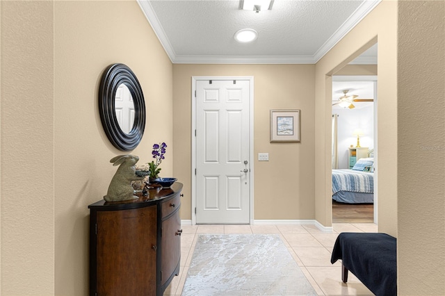 9642 SW 95th Loop, Ocala, FL 34481 - foyer featuring light tile patterned flooring, a textured ceiling, ornamental molding, and ceiling fan