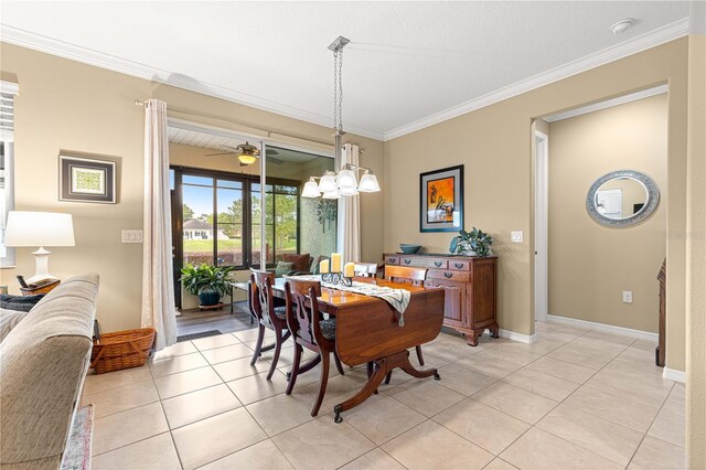 9642 SW 95th Loop, Ocala, FL 34481 - dining room featuring light tile patterned flooring, crown molding, a chandelier, and a ceiling fan