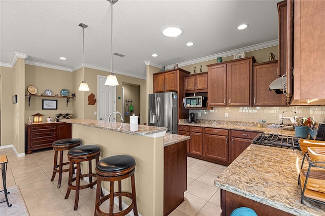 9642 SW 95th Loop, Ocala, FL 34481 - kitchen featuring appliances with stainless steel finishes, light tile patterned floors, backsplash, ventilation hood, and ornamental molding