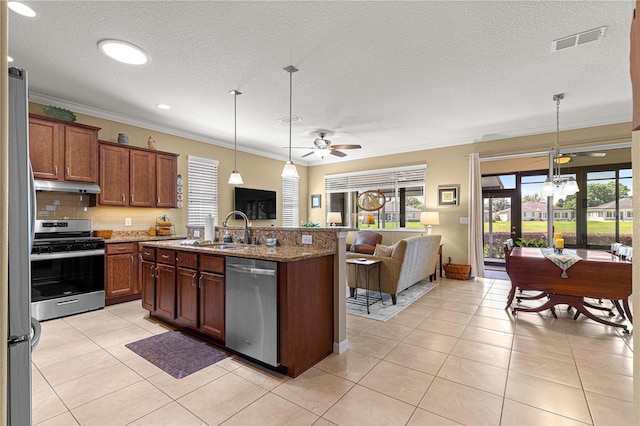 9642 SW 95th Loop, Ocala, FL 34481 - kitchen with appliances with stainless steel finishes, a ceiling fan, open floor plan, ornamental molding, and stone countertops