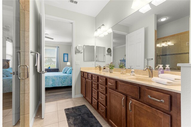 9642 SW 95th Loop, Ocala, FL 34481 - ensuite bathroom with double vanity, ornamental molding, tile patterned floors, and a stall shower