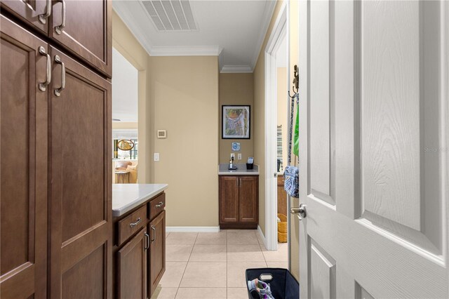 9642 SW 95th Loop, Ocala, FL 34481 - entryway featuring crown molding and light tile patterned floors