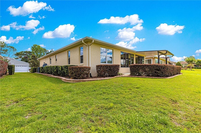 9642 SW 95th Loop, Ocala, FL 34481 - rear view of house with stucco siding and a lawn