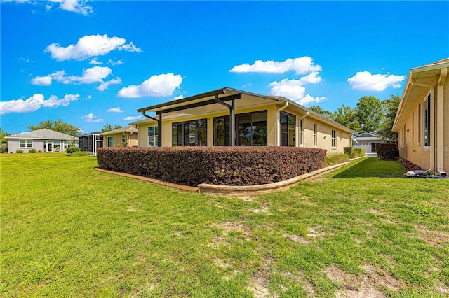 9642 SW 95th Loop, Ocala, FL 34481 - rear view of house featuring a yard