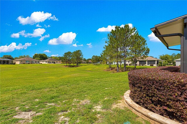 9642 SW 95th Loop, Ocala, FL 34481 - view of green lawn featuring a residential view