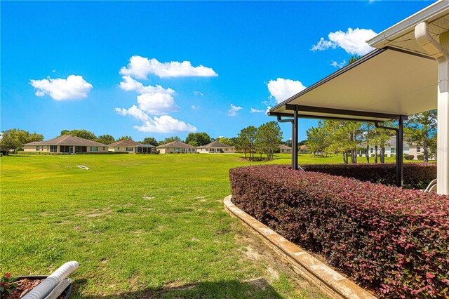 9642 SW 95th Loop, Ocala, FL 34481 - view of green lawn with a residential view