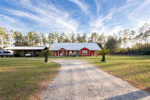 831 SE 11th Pl, Williston, FL 32696 - ranch-style home with driveway, a front yard, and a carport