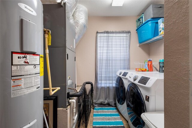 831 SE 11th Pl, Williston, FL 32696 - laundry room with water heater and washing machine and dryer