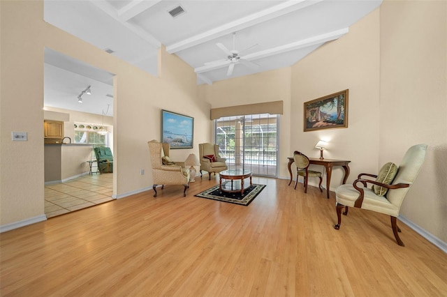 11586 SW 75th Cir, Ocala, FL 34476 - sitting room with beamed ceiling, light wood-style floors, baseboards, ceiling fan, and high vaulted ceiling