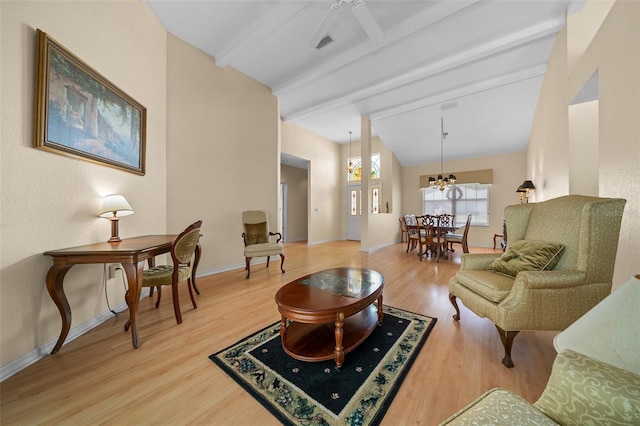 11586 SW 75th Cir, Ocala, FL 34476 - living room featuring light wood-style floors, baseboards, a chandelier, and ceiling fan