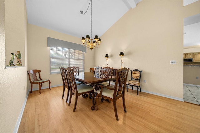 11586 SW 75th Cir, Ocala, FL 34476 - dining space featuring lofted ceiling, light wood-type flooring, a chandelier, and baseboards