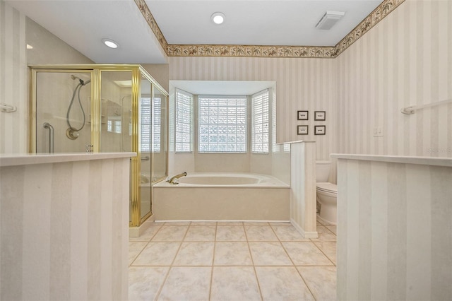 11586 SW 75th Cir, Ocala, FL 34476 - bathroom featuring wallpapered walls, a bath, toilet, a stall shower, and tile patterned floors