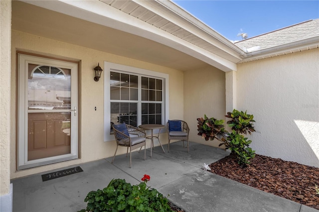 8352 SE 168th Trinity Pl, The Villages, FL 32162 - doorway to property featuring stucco siding