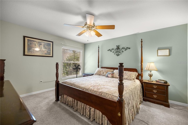 8352 SE 168th Trinity Pl, The Villages, FL 32162 - bedroom with light colored carpet, baseboards, and ceiling fan