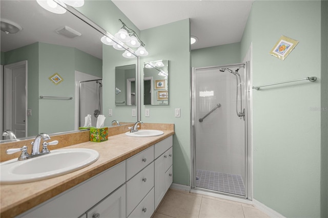8352 SE 168th Trinity Pl, The Villages, FL 32162 - full bath with a stall shower, tile patterned floors, baseboards, and double vanity