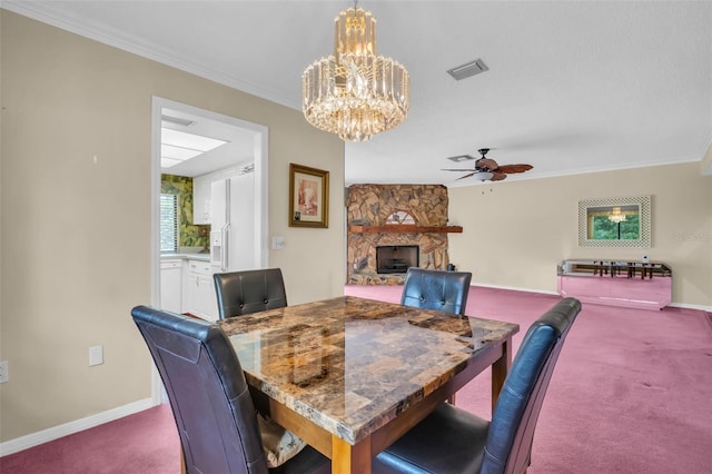 1001 Old Mill Pond Rd, Palm Harbor, FL 34683 - dining space with carpet floors, a chandelier, baseboards, a ceiling fan, and crown molding