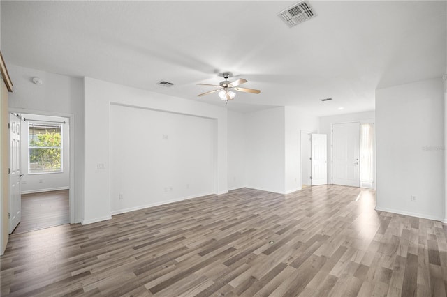 7270 SW 99th Cir, Ocala, FL 34481 - empty room with a ceiling fan, wood finished floors, baseboards, and a smoke detector