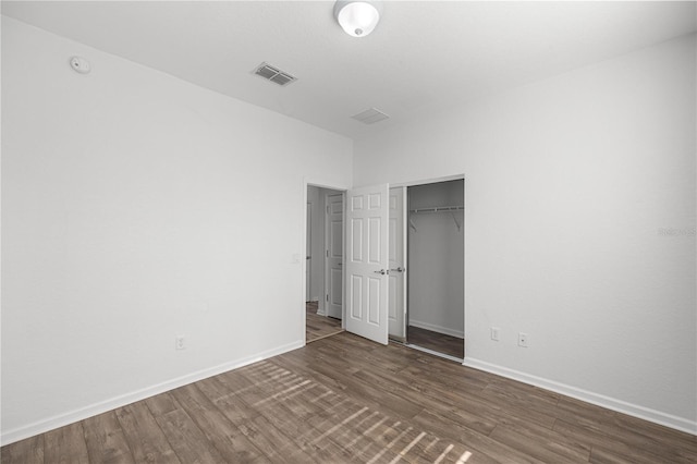 7270 SW 99th Cir, Ocala, FL 34481 - unfurnished bedroom with wood finished floors, baseboards, and a closet