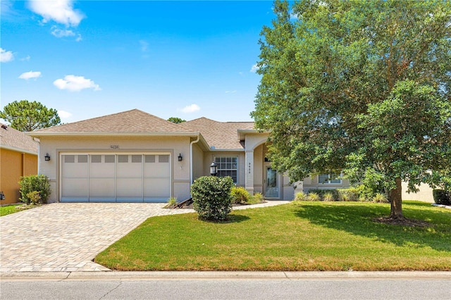 9628 SW 90th St, Ocala, FL 34481 - single story home with a garage, stucco siding, decorative driveway, and a front lawn