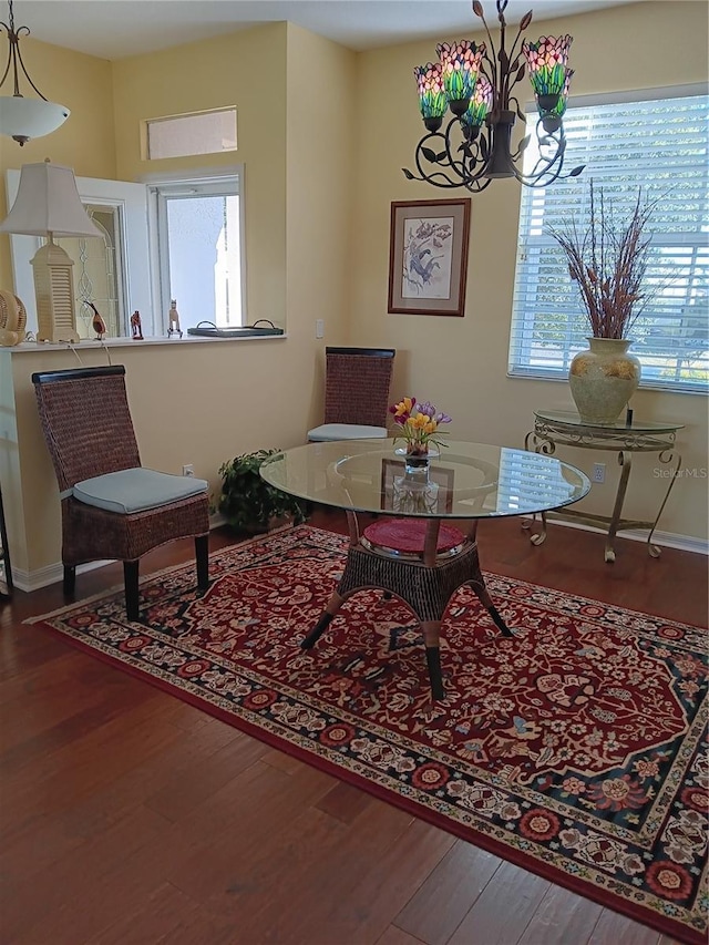 9628 SW 90th St, Ocala, FL 34481 - living area with plenty of natural light, a chandelier, and wood finished floors