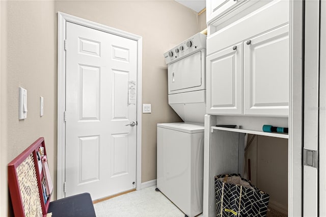 9628 SW 90th St, Ocala, FL 34481 - washroom with stacked washer and clothes dryer and cabinet space