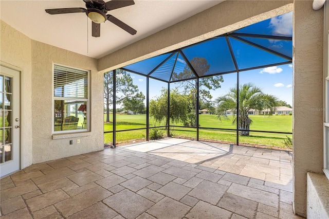 9628 SW 90th St, Ocala, FL 34481 - unfurnished sunroom with golf course view and a ceiling fan