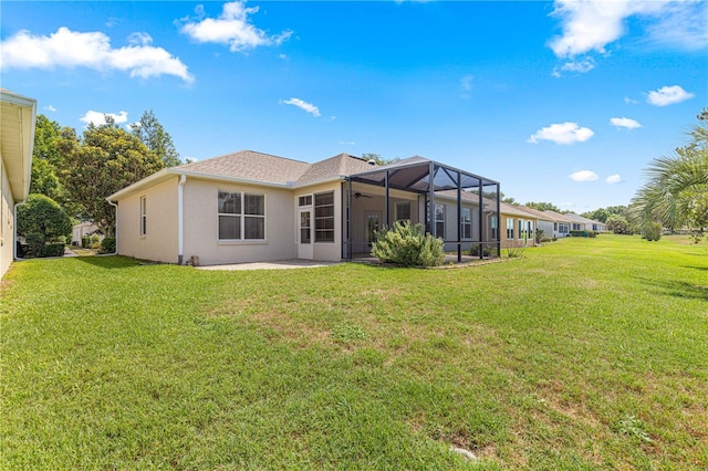 9628 SW 90th St, Ocala, FL 34481 - back of house featuring a yard, a ceiling fan, a patio, and stucco siding