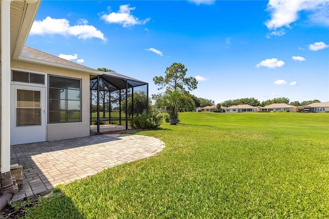 9628 SW 90th St, Ocala, FL 34481 - view of grassy yard with a patio area and glass enclosure