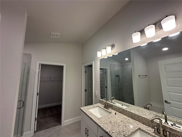 15106 SE 94th Ter, Summerfield, FL 34491 - full bath featuring a stall shower, a walk in closet, double vanity, tile patterned floors, and a garden tub