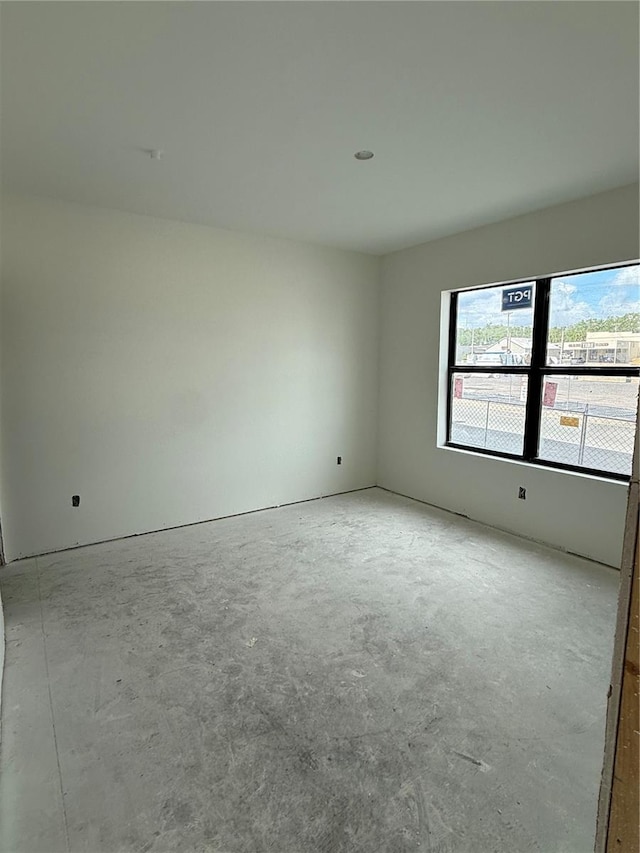 spare room featuring concrete floors
