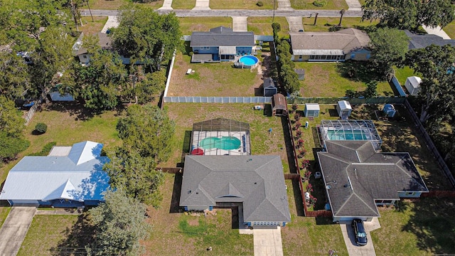 aerial view of residential area with a pool