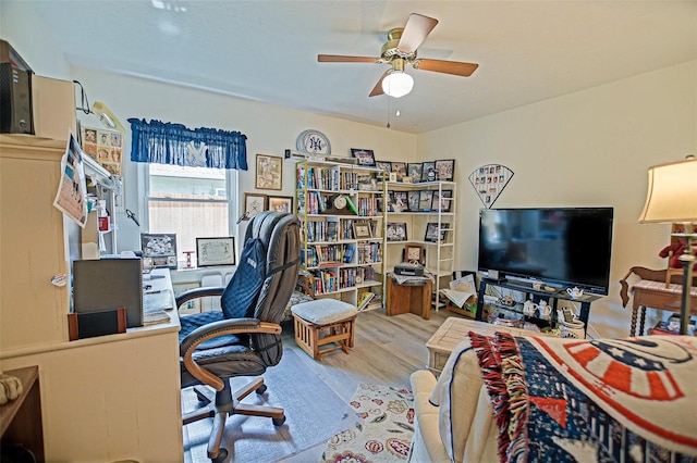 office space featuring wood finished floors and ceiling fan