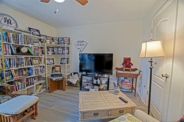 living area featuring ceiling fan and wood finished floors