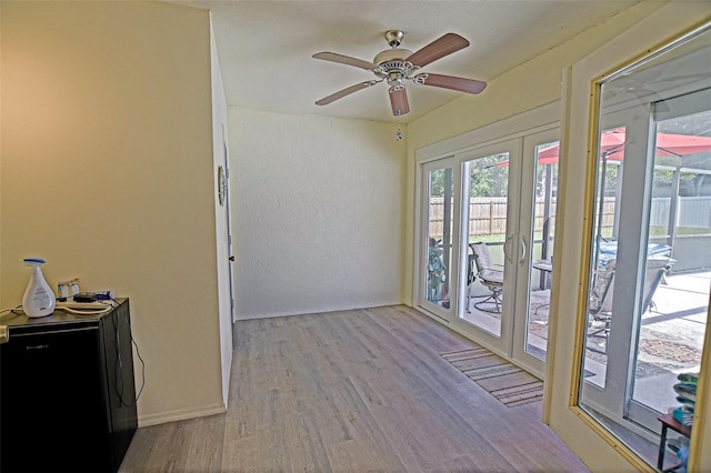 unfurnished sunroom featuring french doors