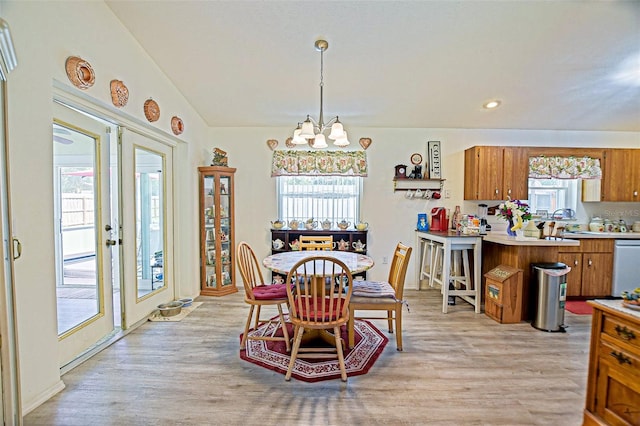 dining space with a chandelier, light wood-type flooring, and recessed lighting