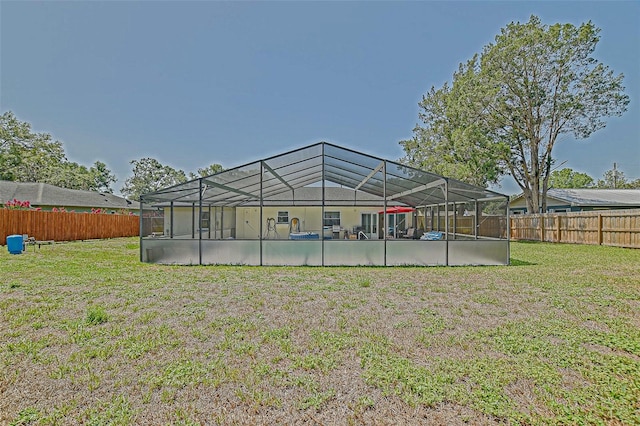 rear view of property with glass enclosure