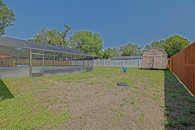 view of yard with a shed and an outbuilding
