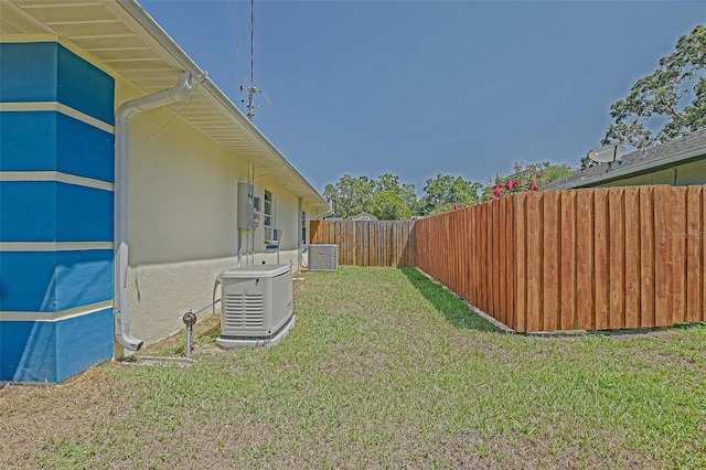 view of yard with central AC